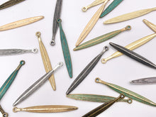 Load image into Gallery viewer, 5x51mm Pewter Carved Skinny Leaf Pendants Bulk Order in Gold, Matte Gold, Silver, Brass, Gunmetal, Blue And Green Patina