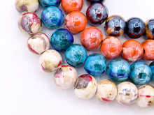 Cargar imagen en el visor de la galería, Cuentas redondas brillantes de porcelana de cerámica galvanizada de 14 mm con orificio grande para la fabricación de joyas en tortuga, naranja, azul y crema alrededor de 11-12"