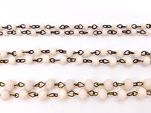 Cargar imagen en el visor de la galería, Cream/Blush Crystal Rondelle Faceted Rosary Beaded Chain With Brass Wire By Spool 4mm 6mm 8mm