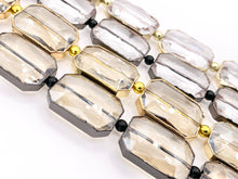 Cargar imagen en el visor de la galería, 18x26mm Gold/Gunmetal Trimmed Faceted Shiny Dyed Glass Rectangle Crystal Strands Clear and Champagne Around 7" Price For 1 Strand