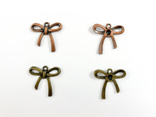 Load image into Gallery viewer, 26x25mm Pewter Christmas Bow Tie Charm in Antique Copper and Brass 125 Grams Bag