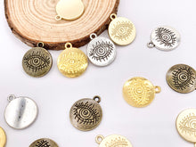 Load image into Gallery viewer, 16mm Pewter Evil Eye Carved Circle Pendants Curved Coin One Sided Charms Bulk Order in Gold, Matte Gold, Silver, Brass
