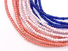 Cargar imagen en el visor de la galería, Cuentas de semillas africanas de 3 mm hechas a mano de vidrio de Ghana en coral, rosa claro y azul
