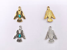 Cargar imagen en el visor de la galería, 20x28mm Pewter Thunderbird Pendants with Turquoise Howlite in Gold, Silver Gunmetal and Bronze Color
