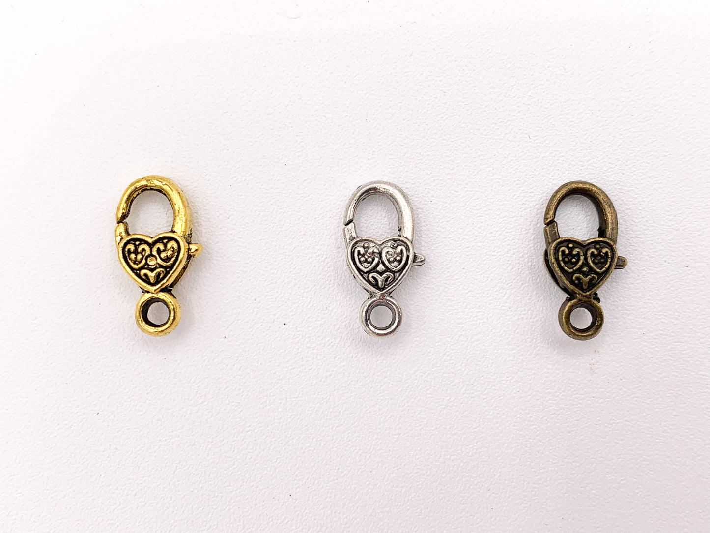 Cierres de garra de langosta con forma de corazón antiguo de peltre de 9x17 mm, pedido a granel en oro, plata y latón, 24 piezas