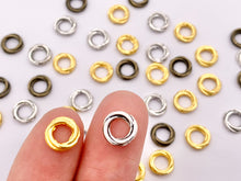 Load image into Gallery viewer, 8mm Pewter Love Knot Spacers Twisted Ring Space Beads in Gold, Silver, Bronze 125g
