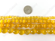 Load image into Gallery viewer, Faceted Round Cat&#39;s Eye Dyed Sunshine Yellow Beads Around 15&quot;
